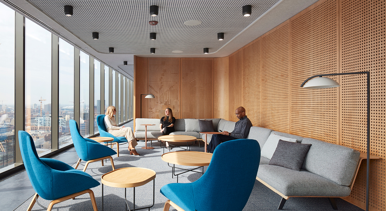 grey acoustic panels with perforations installed on ceiling above seating area