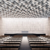 Beige Ecoustic Apex acoustic baffles over auditorium
