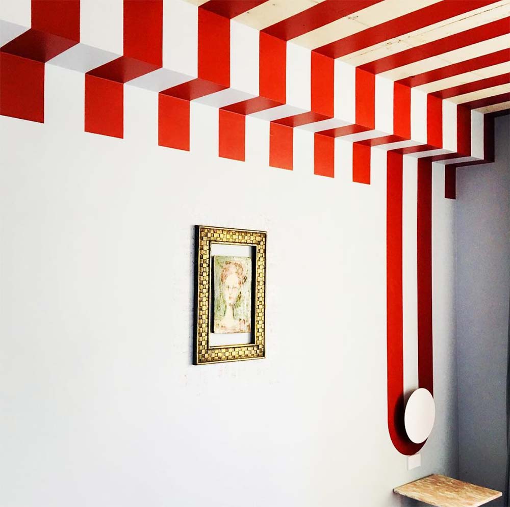 Red & White striped ceiling design for art exhibit
