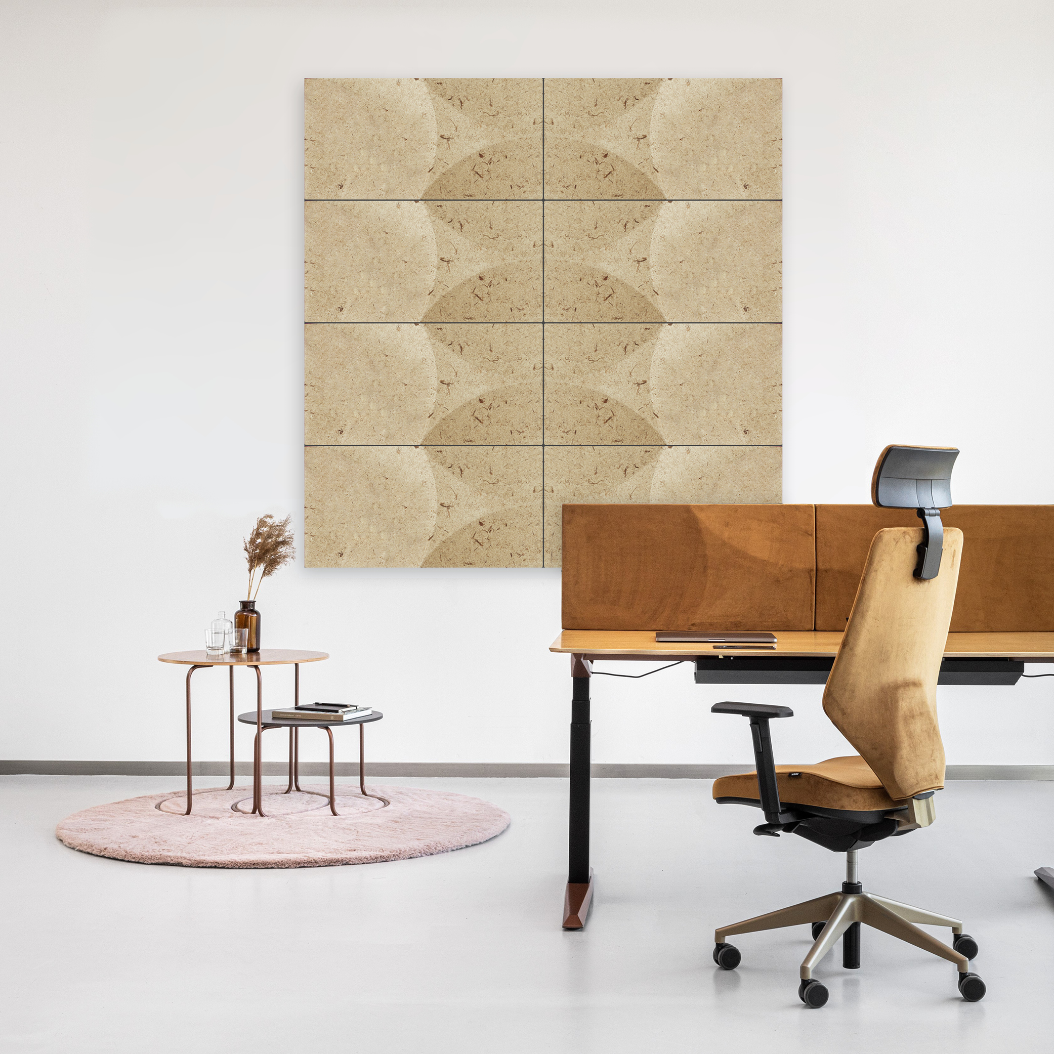 plant based acoustic tiles on wall with desk and stools on small rug