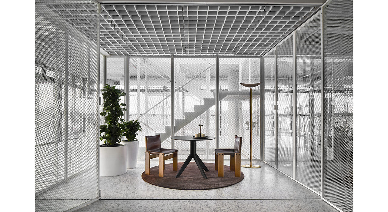 bright open office with sound absorbing grey ceiling tiles