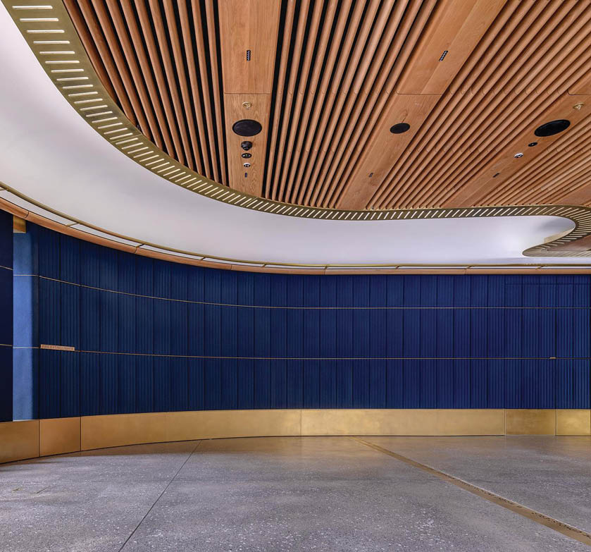 dark blue acoustic tiles with linear pattern on auditorium wall
