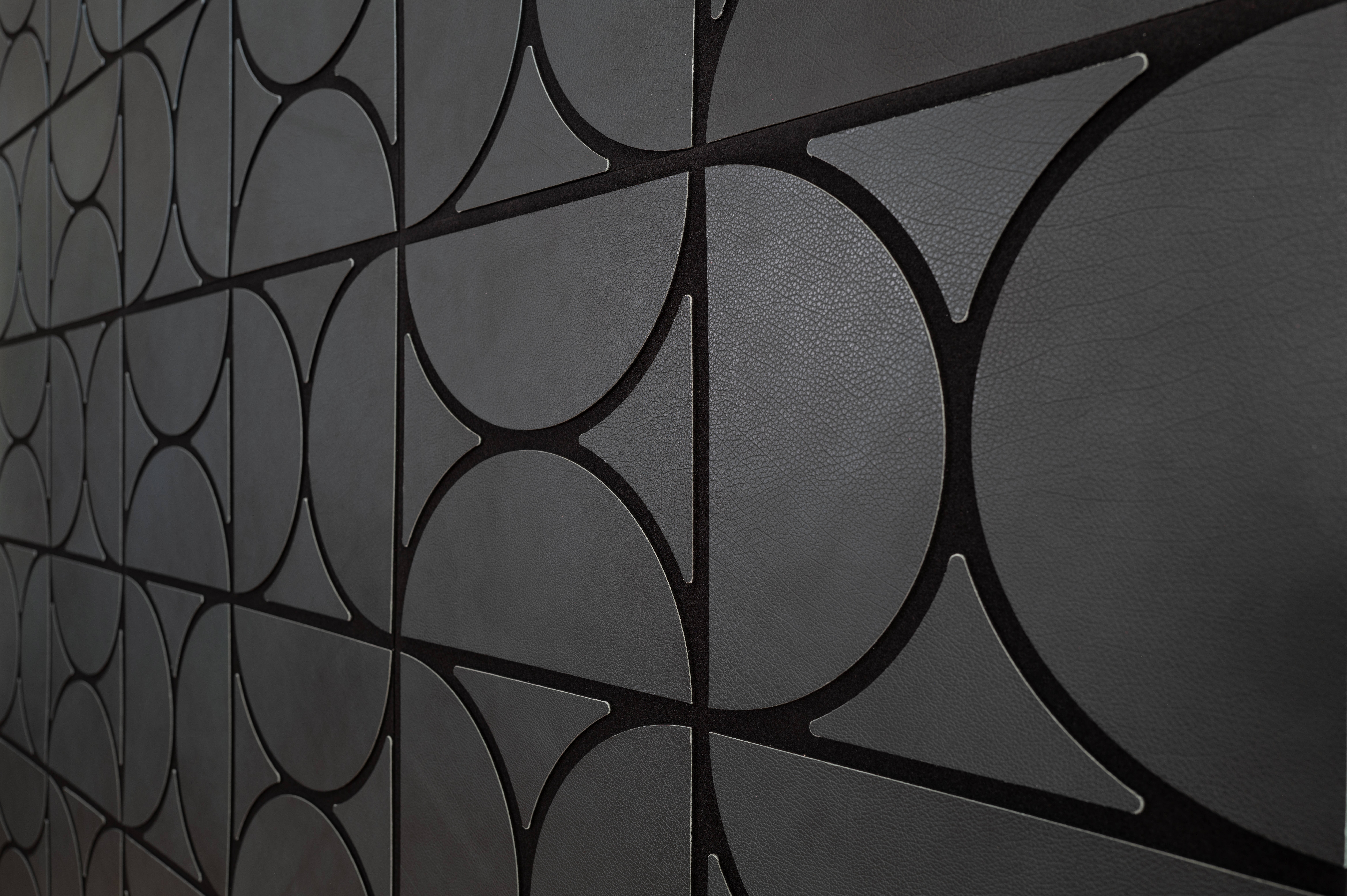 geometric shaped leather with a black core reveal detail