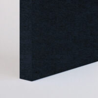 corner of a dark blue acoustic panel