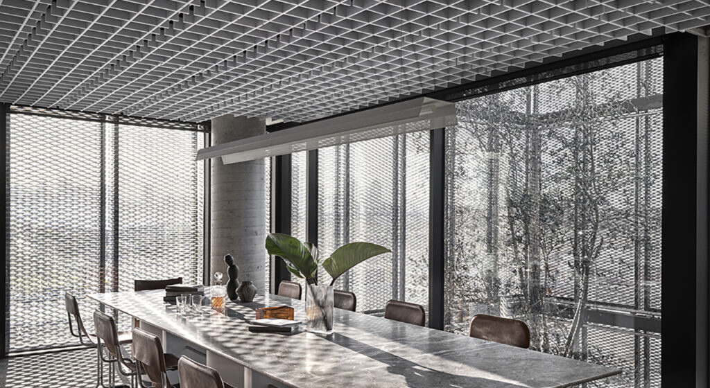 bright conference room with large windows sound absorbing drop ceiling tiles