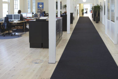 long acoustic wool felt rug on wooden floor