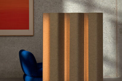 acoustic lighted floor screen in room with blue chair